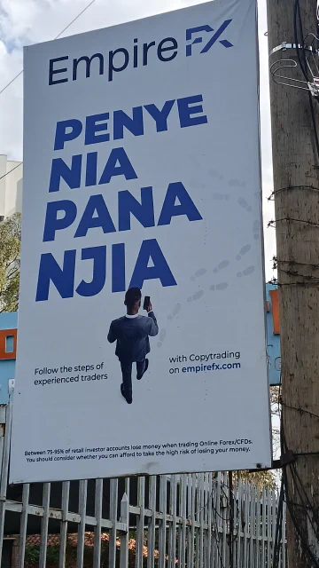 Billboard reading 'Penye nia pana njia' (where there is a will, there is a way)